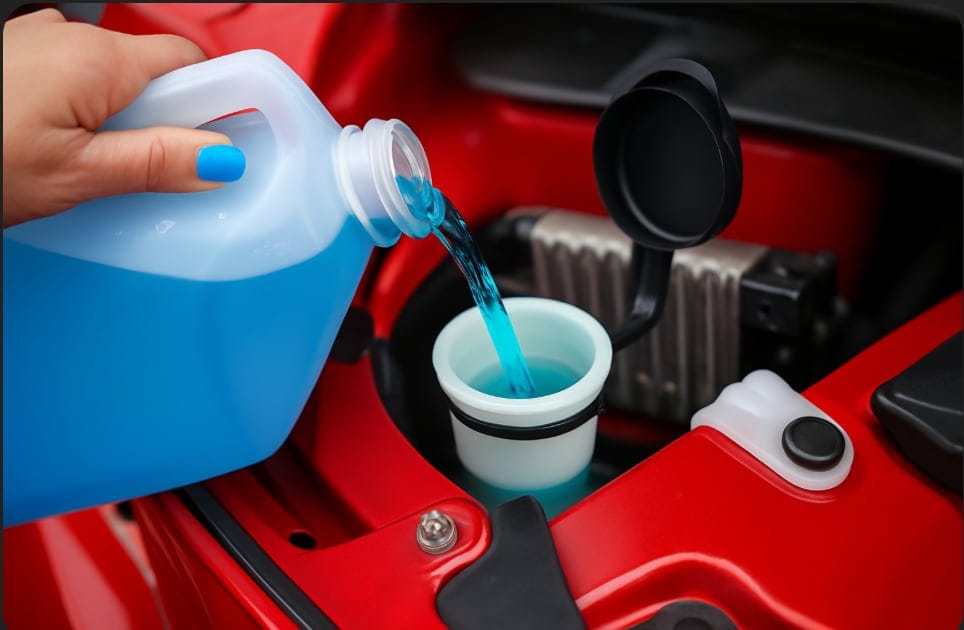 fluid exchage p1 2 washer fluid being replenished